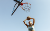 Player throwing a ball into a basket